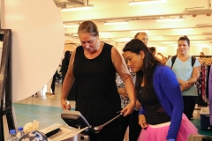 Participants getting a body composition analysis by Daman